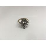 An unusual 9ct gold stone set cluster ring. Weight approx 4.11g Size approx T