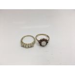 Two 9ct gold rings set with opals and garnets. Weight approx 3.94g Size approx O & M/N