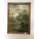 A framed oil painting depicting a fisherman by a river. Signed T. Spink. Size approx 39x29cm