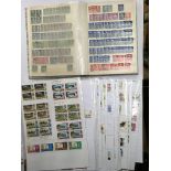 A box containing 7 albums of world postage stamps and a box of stamps on pages.