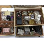A box of wooden costume jewellery.