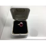 A 9ct gold ring with red stone. Weight approx 3g Size approx K/L