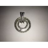 A fine quality, modern design 18ct white gold circular pendant, encrusted with fine quality