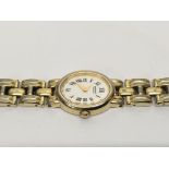 A Seiko gold tone ladies watch.