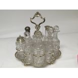 A Silver Victorian framed cruit set with eight cut glass bottles some damage.