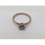 A 9ct gold and platinum ring set with a cz, approx size P-Q and approx 1.9g.