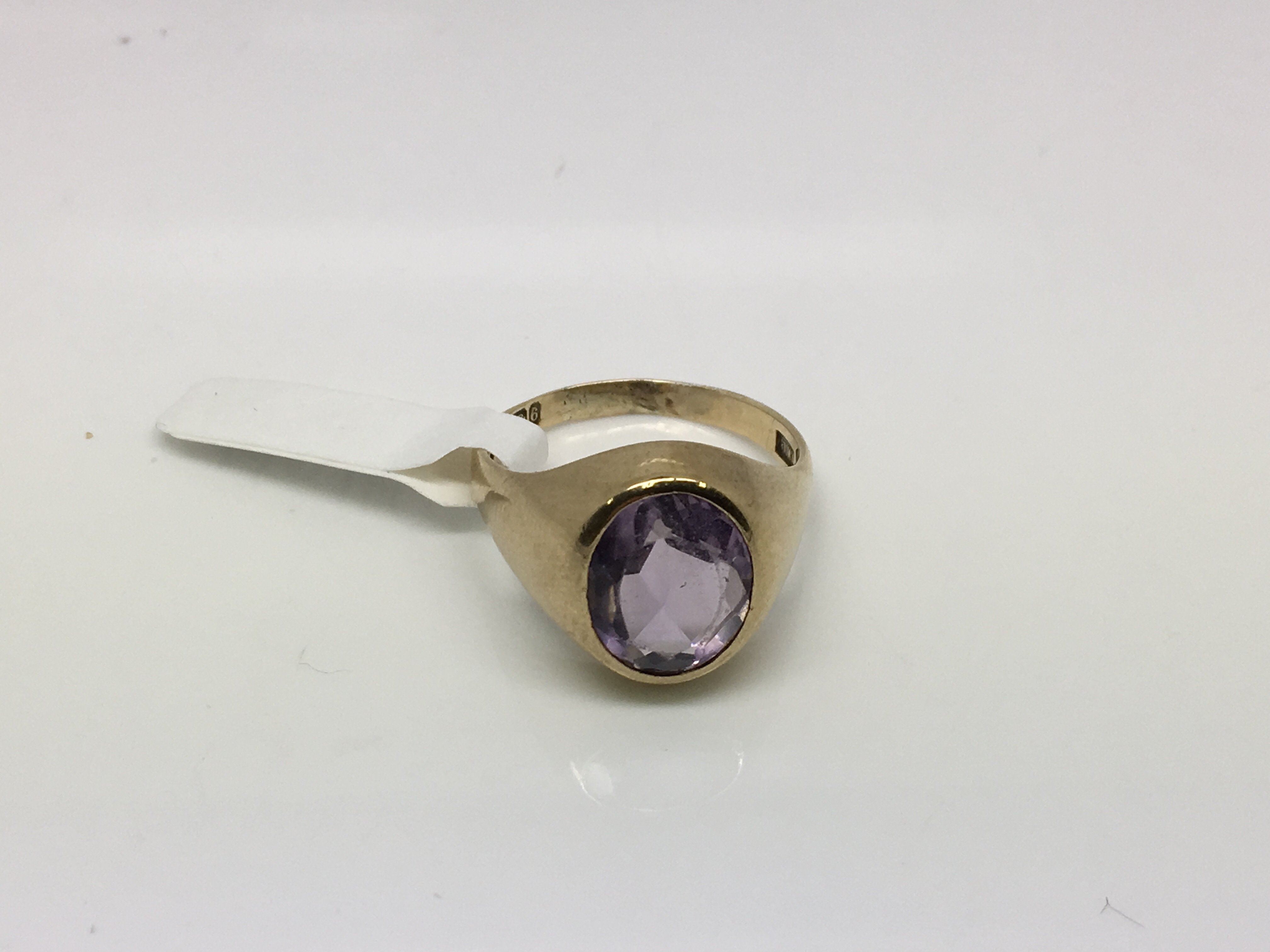 A 9ct gold oval amethyst ring, approx size R-S and approx 6.6g.