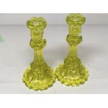 A pair of Early 20th Century Uranium glass candle sticks height 23cm