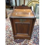 A small mahogany coal box with brass handles