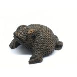 A well carved, wooden snuff box formed as a toad,