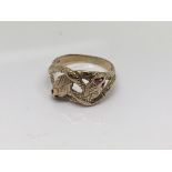 A 9ct gold ring in the form of two snakes with ruby eyes. Ring size R. Weight 4.5g