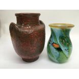 A two handled pottery vase and a Mdina style glass