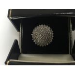 A 9 ct gold diamond cluster ring size R