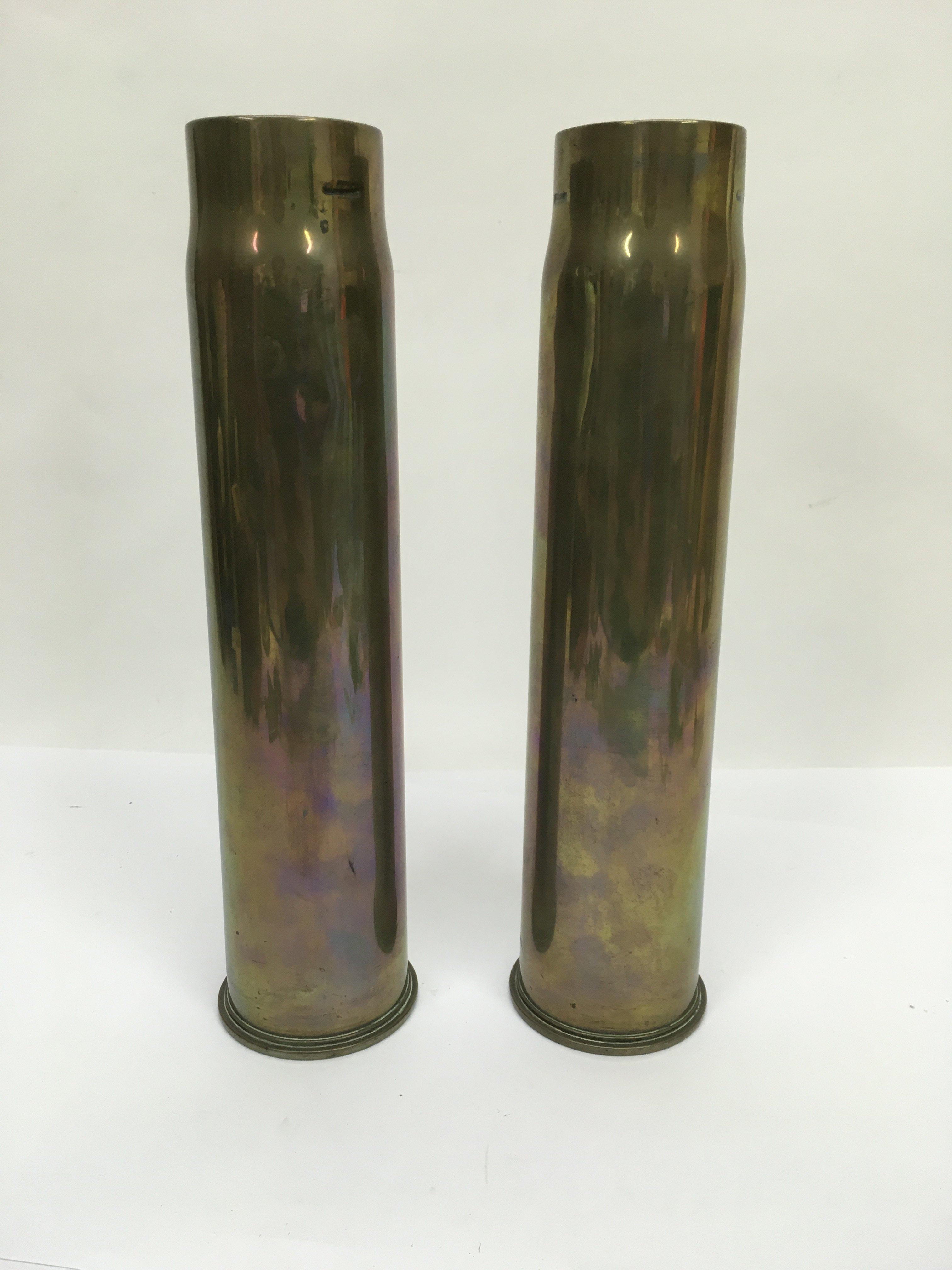 Two brass shell cases.