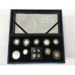 A Queen's 80th birthday silver proof coin set.