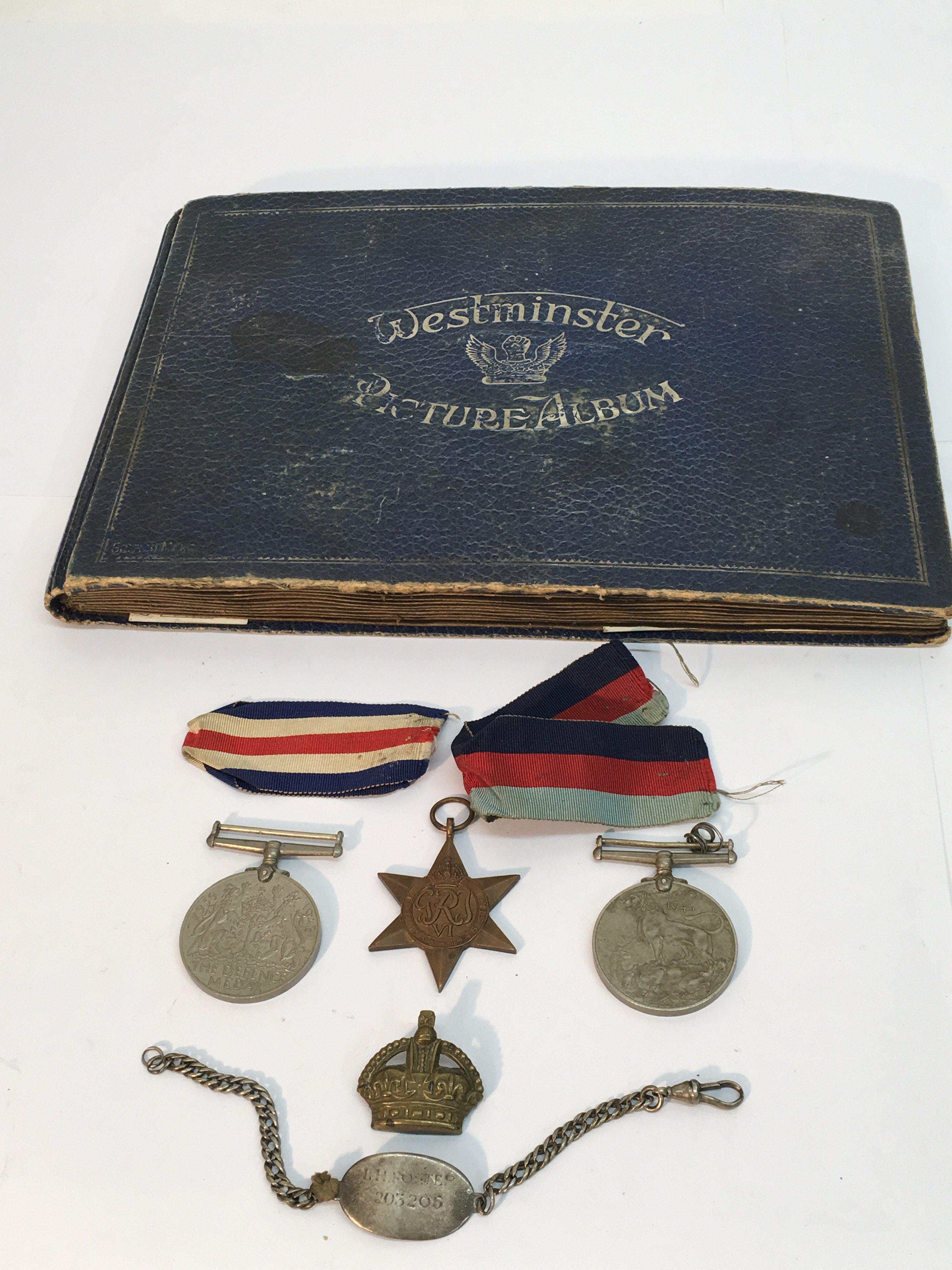 A WW2 medal group, I.D. bracelet, and a cap badge