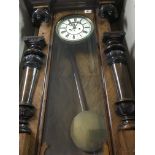 A walnut Case Vienna wall clock with double weight and pendulum