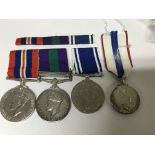 A Group of medals comprising a Palestine campaign medal awarded to 14458479 GNR B.Ward R.A, a II