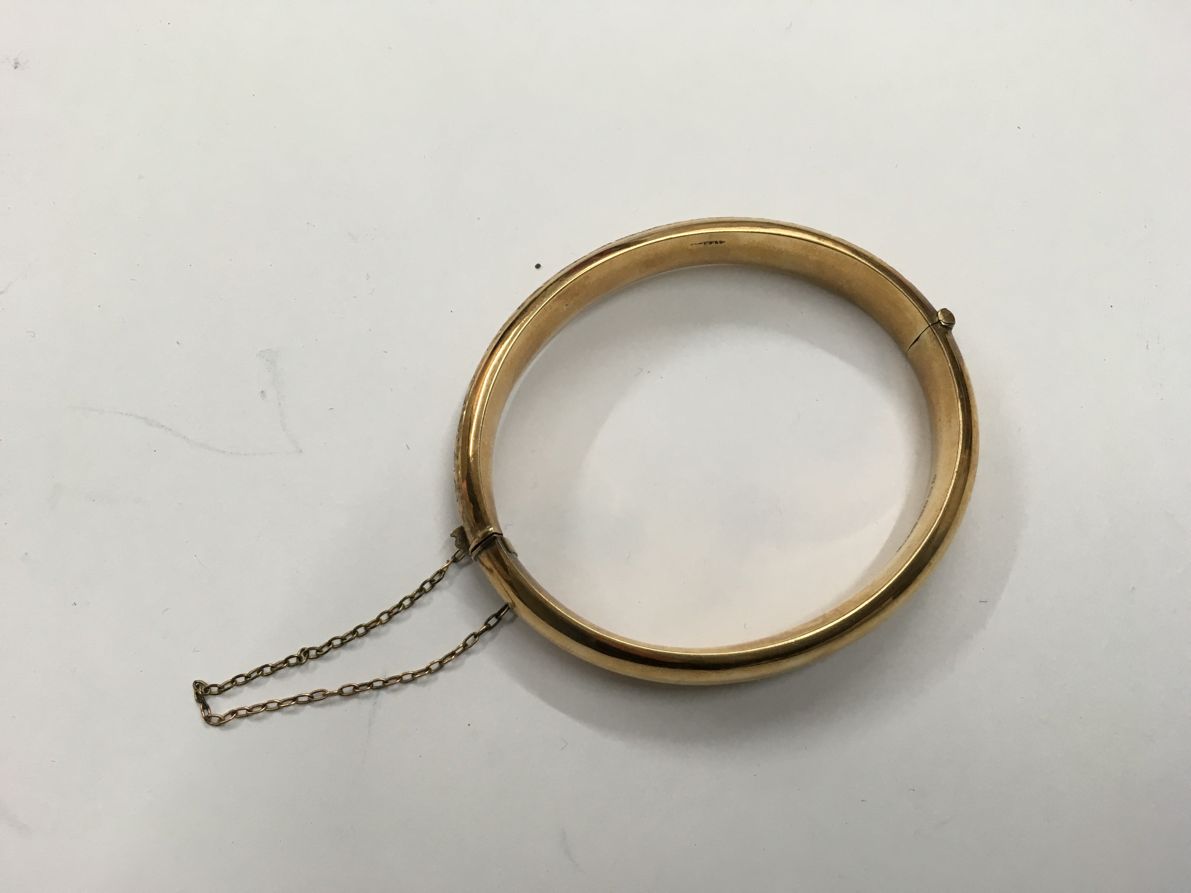 A 9ct gold bangle. Weight approx 13g