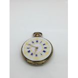 A lady's 18k gold button wind pocket watch with enamelled dial, lacking glass