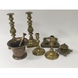 A pair of late 18th Century brass candle sticks with octagonal bases, a bronze Morter and Pestle two