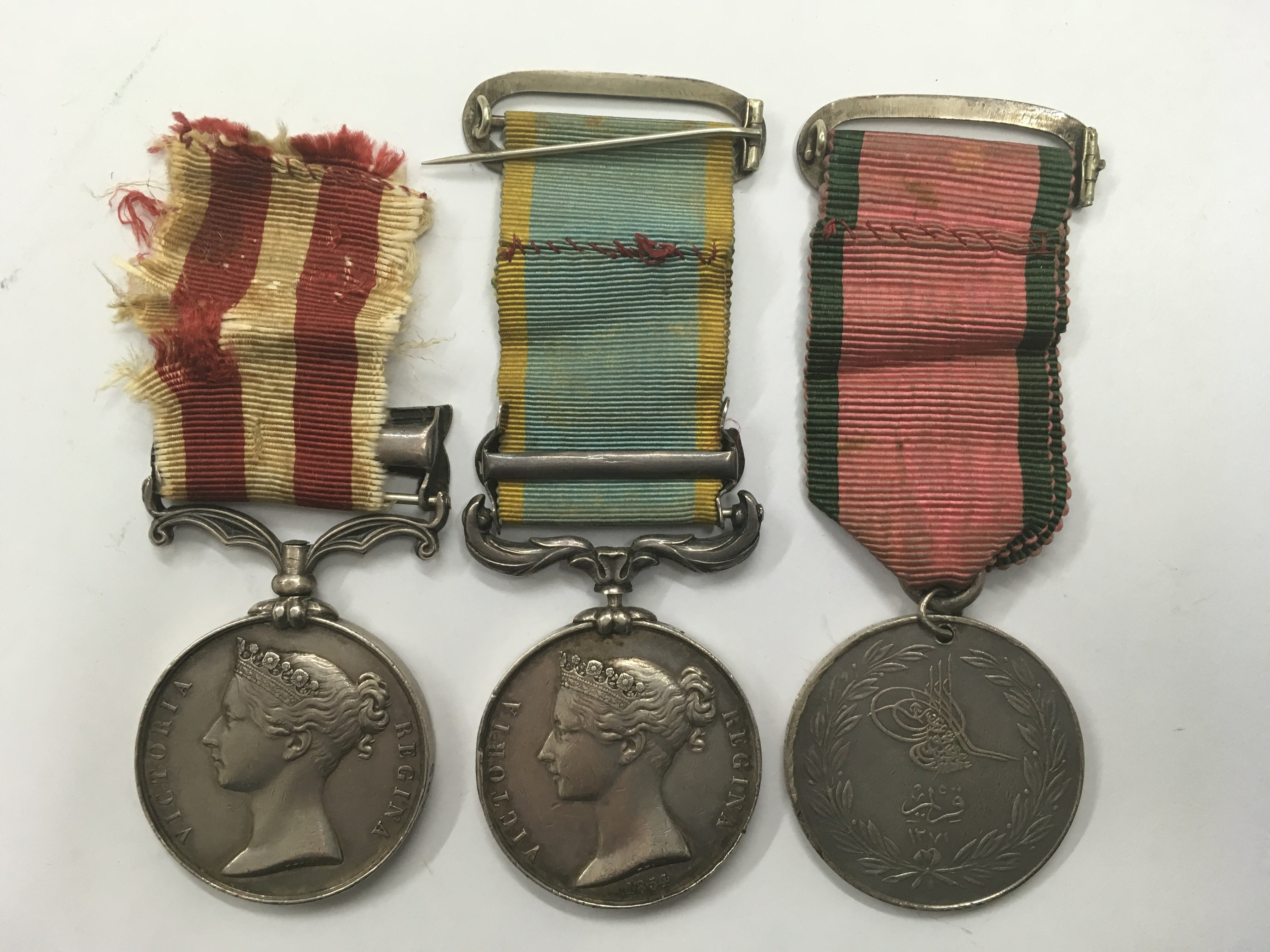 A group of 3 Victorian War medals. An Indian mutiny medal with 'Central India' bar awarded to - Image 2 of 3