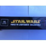 A boxed Star Wars MR Master Replica Force FX Darth Vader lightsabre.