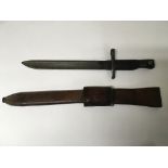 A US army WW1 Canada Ross Mk. 1 bayonet with leather scabbard. Faded makers marks.