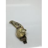 A 9 ct gold lady's Omega watch with applied strap