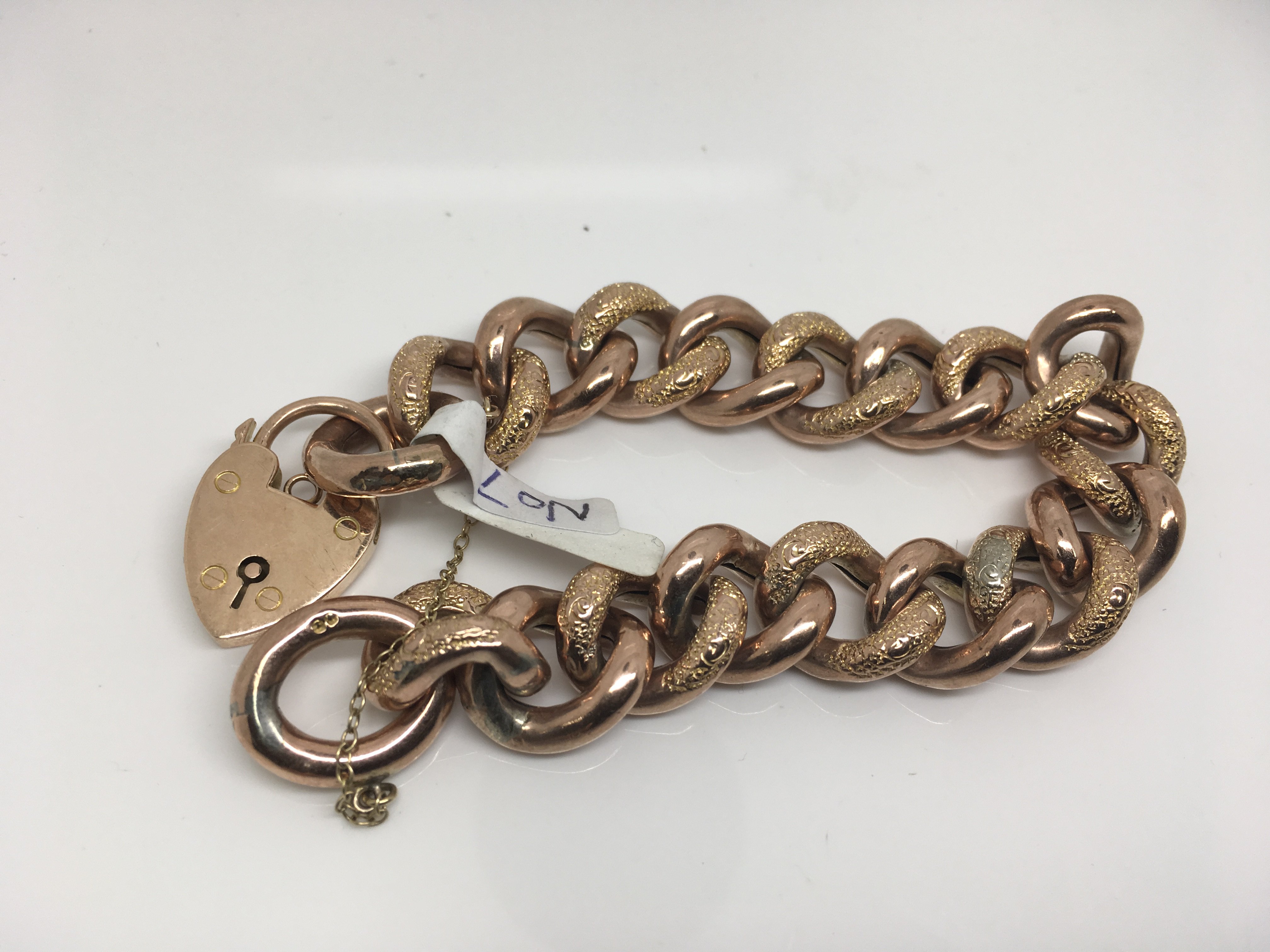 A 9ct red gold curb link bracelet. Weight approx 34.61g - Image 2 of 2