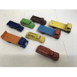 A small collection of unboxed Dinky Toys including Fiat bed lorries.