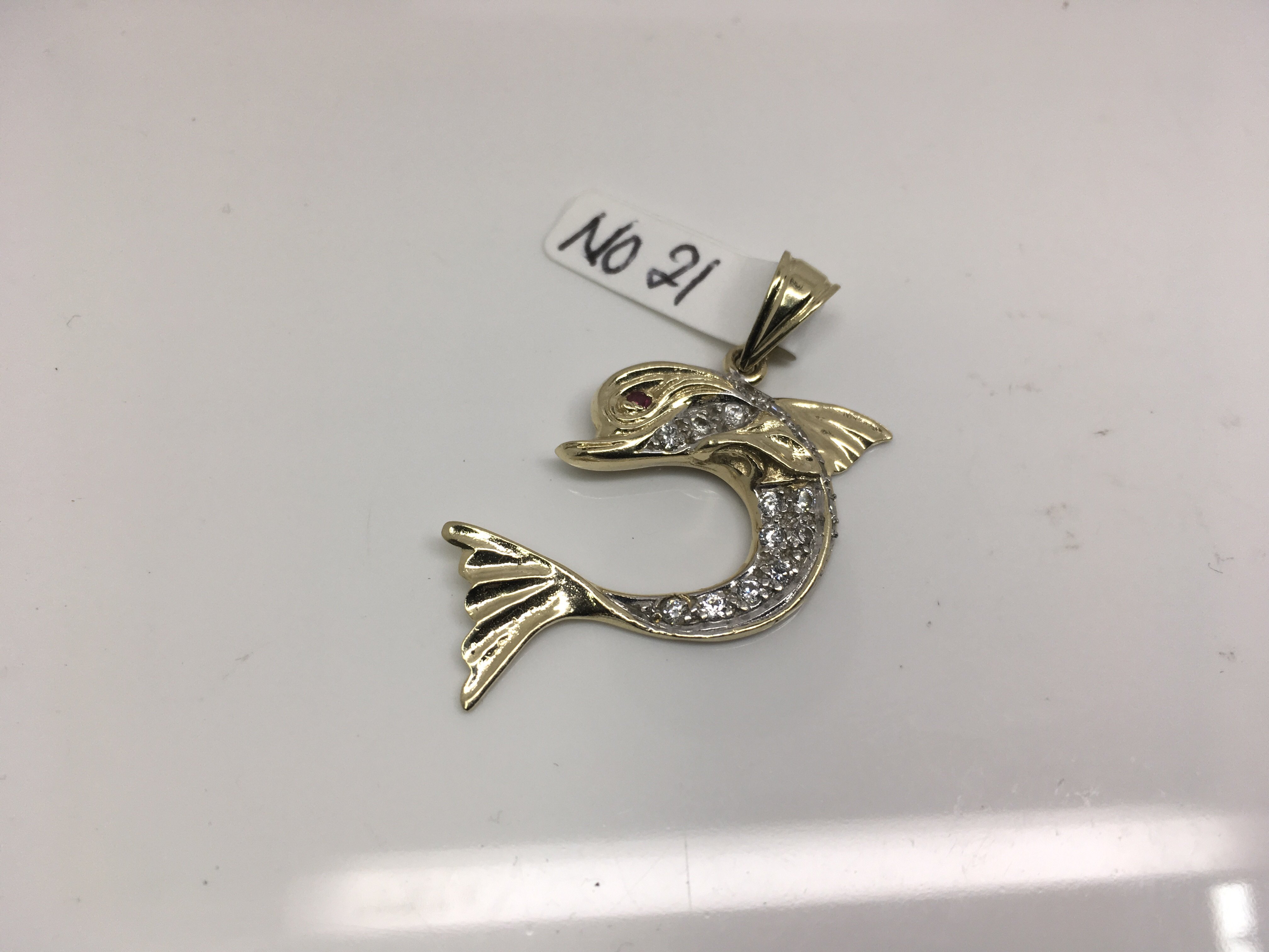 A 9ct gold stone set dolphin pendant. Weight approx 5.60g