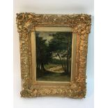 A 19th century gilt framed oil on board painting of a rural tree lined path, unsigned.