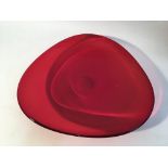 A red Art Nouveau glass dish.