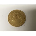 A George III 1821 Gold Full Sovereign, Slight surface scratches slightly worn good condition,