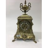 An Victorian gilt metal clock of classic style the circular dial with Roman numerals French movement