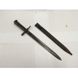 An Italian M1891 bayonet manufactured by Terri with a two piece hard wood grip and a ribbed steel