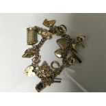 A 9ct gold charm bracelet 39 grams approx