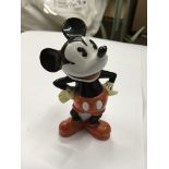 A figure of 'Mickey Mouse' with a compartment in the back to possibly hold toothpicks.
