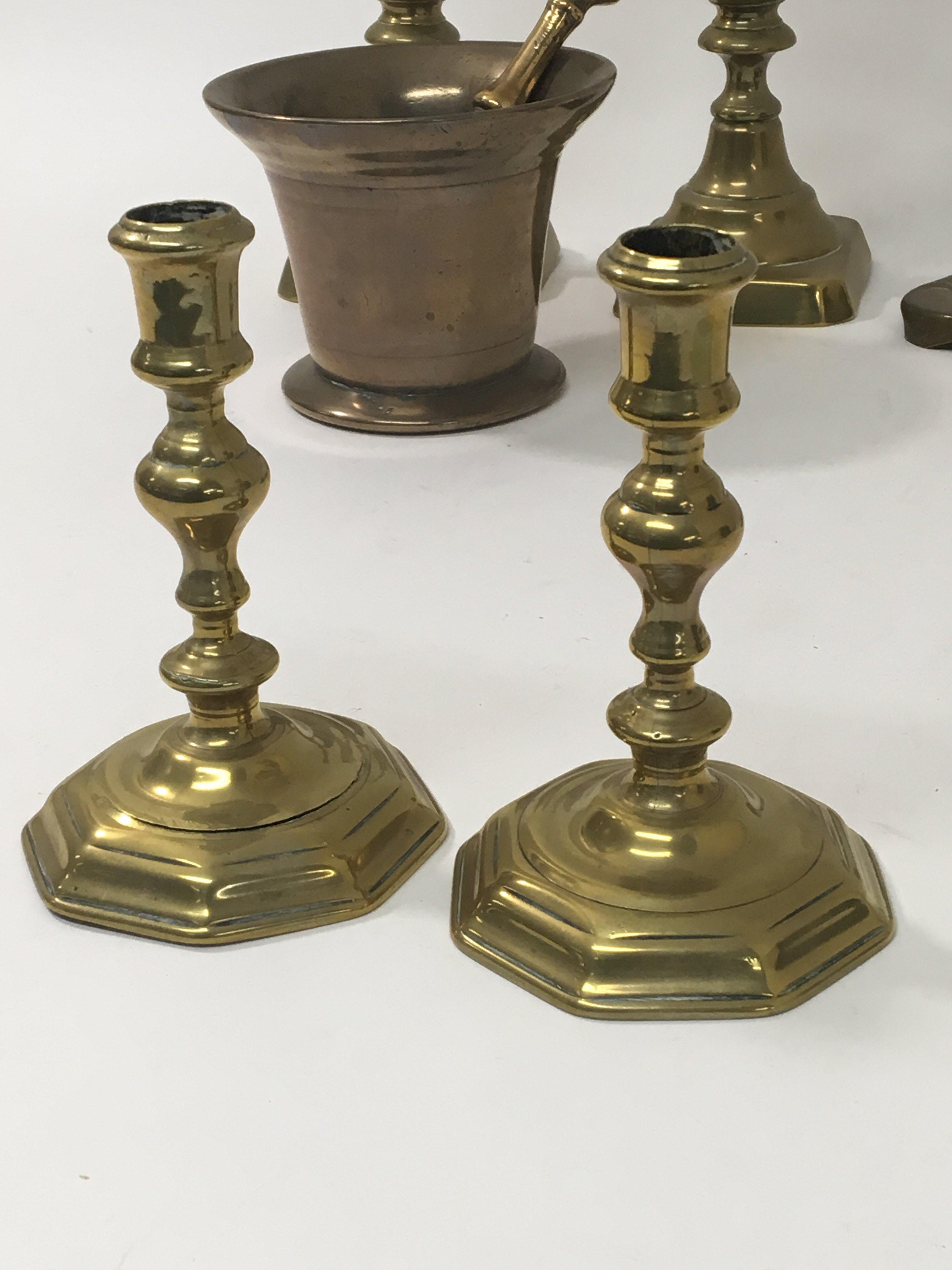 A pair of late 18th Century brass candle sticks with octagonal bases, a bronze Morter and Pestle two - Image 2 of 3