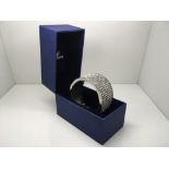 A Swarovski bangle in original box.