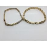 Two modern design 9ct gold bracelet one with alternating white and yellow gold decorated with