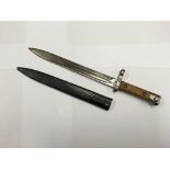 An Austrian M1895 bayonet for use with the Mannlicher rifle, the hilt stamped "60 63". Includes