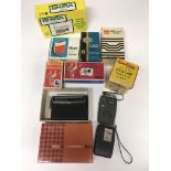 An interesting collection of 1960 s boxed / unboxed transistor radios and a boxed cycle lamp