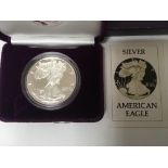 A 1986 silver proof American eagle diameter 40.60mm weight one Troy ounce packaged in the United