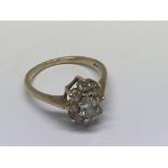 A 9ct gold ring inset with a cluster of CZ stones.