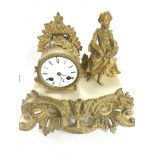 A gilt metal and marble mantle clock with mounted lady and enamel dial 29cm