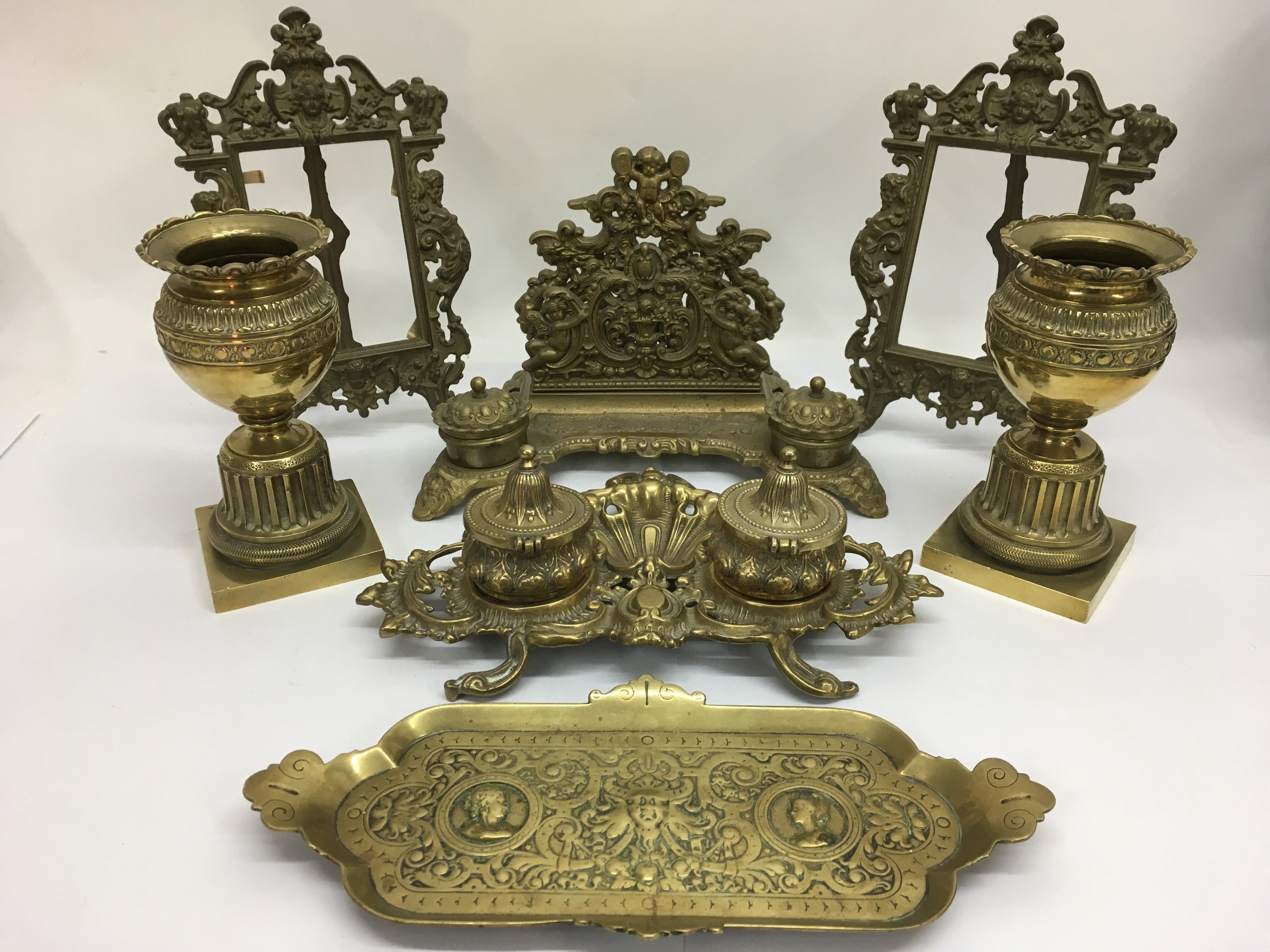 A collection of brassware comprising two ink stand