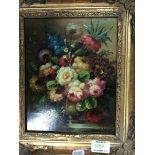 A gilt framed oil painting on board still life study with flowers, and a small signed coloured
