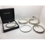 Four silver bangles plus a boxed Warren James bang